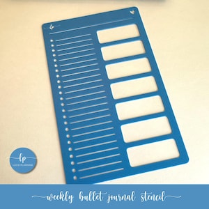 May include: A blue plastic weekly bullet journal stencil with rectangular and lined cutouts. The stencil has a series of horizontal lines and rectangular boxes for planning. The text "weekly bullet journal stencil" is at the bottom.