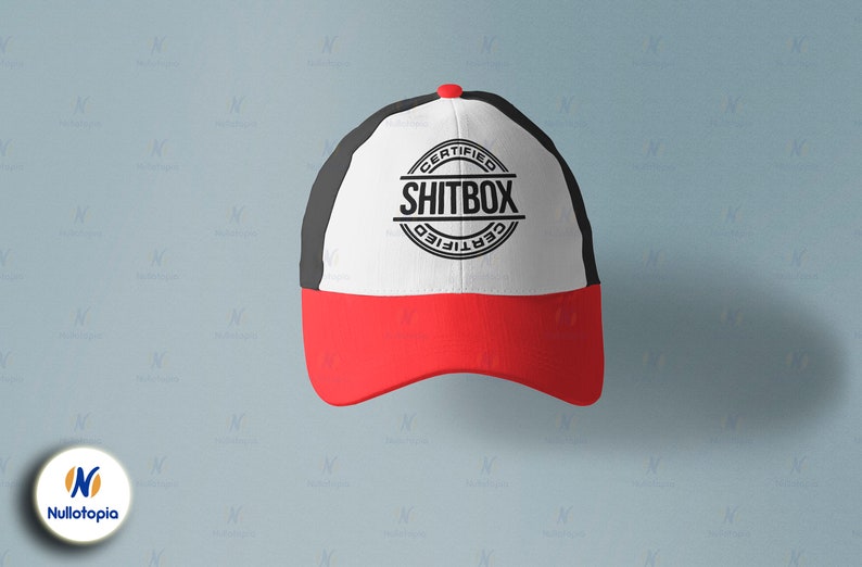 May include: A black and white baseball cap with a red brim. The front of the cap has a white circle with the text "CERTIFIED SHITBOX CERTIFIED" in black.