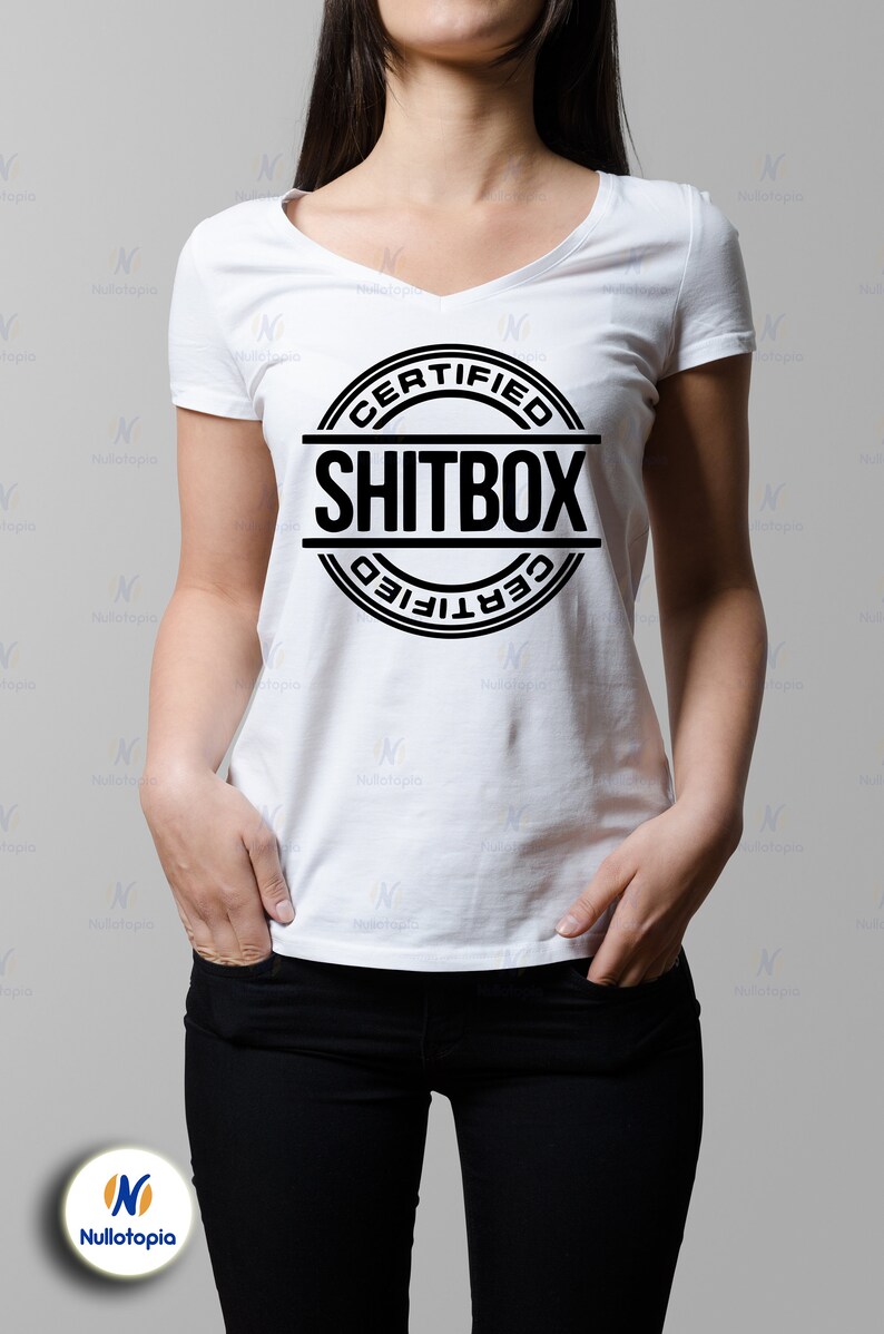 May include: A white t-shirt with a black circle graphic that says "CERTIFIED SHITBOX" in all caps.