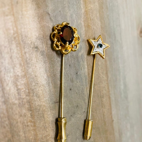 Vintage hat/lapel pins. set of 2. faux ruby/garnet gold tone and gold tone star rhinestone faux saphhire center