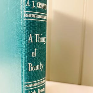 Vintage teal hardcover book A Thing Of Beauty by A.J. Cronin. 1950&#39;s Old books. library academia
