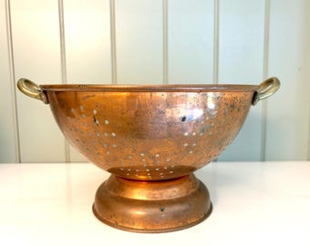 Vintage/antique copper colander/strainer with brass handles. Copperware