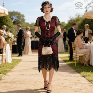 May include: A woman in a burgundy and black flapper dress with black fringe, gloves, and heels, carrying a pearl-studded purse. She wears a pearl necklace and a beaded headband. The scene is an outdoor event with guests and tables.
