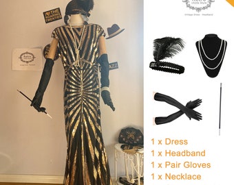 May include: A 5-piece flapper costume set in black and gold. The set includes a sequined dress, a feather headband, a pair of long gloves, a pearl necklace, and a cigarette holder. The text "Retro 1920s Style" is visible in the image.