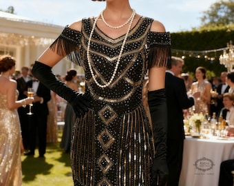 May include: A black flapper dress with gold sequin and fringe detailing. The dress features a geometric pattern and is accessorized with long black gloves, a pearl necklace, and a jeweled headband with a feather. The image is set outdoors.