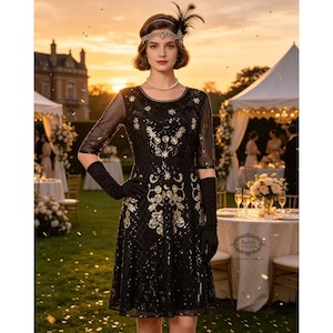 May include: A black knee-length dress featuring gold sequin floral patterns, sheer three-quarter length sleeves, and a round neckline. The garment is paired with black elbow-length gloves and a decorative headpiece with a black feather accent.