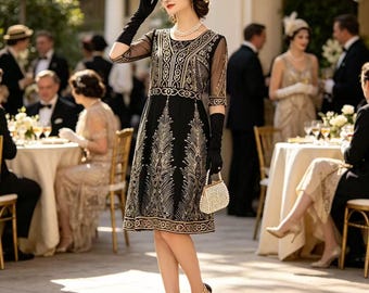 May include: A black knee-length dress featuring intricate gold embroidery in a geometric and feather-like pattern, sheer elbow-length sleeves, a round neckline, and a matching gold beaded headband, paired with black opera gloves and a small beaded clutch.