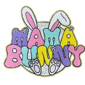 May include: A colourful felt Easter doormat with the words "Mama Bunny" and a white bunny with pink ears.