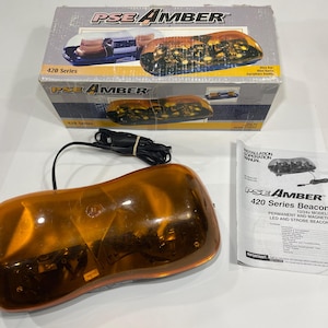 May include: An amber-colored PSE Amber 420 Series beacon with a black power cord, a box, and an installation manual. The box features images of the beacon. The manual is titled "420 Series Beacon".
