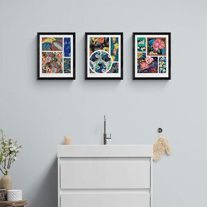 May include: Three framed art prints with colorful floral and abstract designs hang above a white bathroom vanity. The prints feature a variety of patterns and colors, including blues, oranges, and pinks. The frames are black.