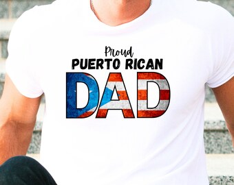 May include: White t-shirt with the text "Proud Puerto Rican DAD". The word "DAD" is designed with the Puerto Rican flag. The shirt is a crew neck style.