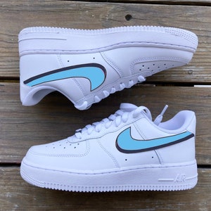 Custom Air Force 1s with light blue and navy 3D Nike Swoosh
