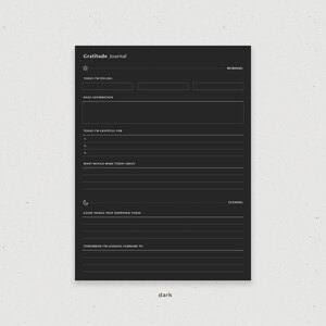 May include: A black and white gratitude journal with prompts for morning and evening reflection. The journal includes sections for daily affirmations, things you are grateful for, and things that would make your day great.