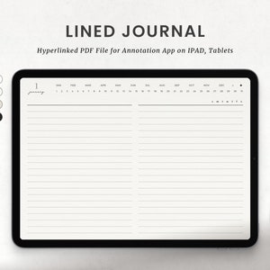 May include: A white iPad with a black border displaying a lined journal page with a calendar at the top. The calendar shows the months of the year and the days of the week. The journal page is blank and ready for writing. A white stylus is lying on a white surface next to the iPad.