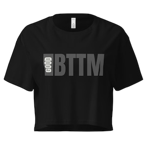 May include: Black cropped t-shirt with the text "GOOD BTMM" printed in gray on the front.