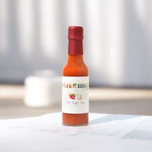 Organic Garlic Hot Pepper Sauce Handcrafted Pimant Bouc Blend with Organic Ingredients spicy, flavorful condiment organic garlic hot-sauce