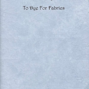 May include: A light blue 14 ct Aida Zweigart fabric with a woven grid texture. The text printed on the fabric reads: Cornish Pixie, shade 3, 14 ct Aida Zweigart, To Dye For Fabrics. The material has a consistent, uniform light blue color.