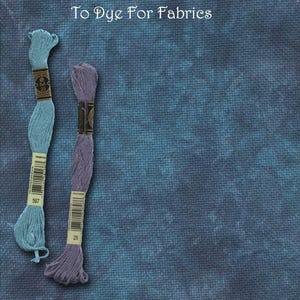 May include: Two spools of embroidery floss in light blue and lavender, with labels, sit on a textured blue background. The text "Seas The Day" and "To Dye For Fabrics" are visible.
