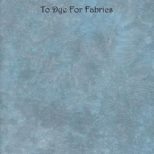Puede incluir: Tela azul claro con apariencia texturizada. El texto "Frosted Shadow 14 ct Aida Zweigart" y "To Dye For Fabrics" están impresos en la tela. La tela tiene un patrón sutil y moteado.