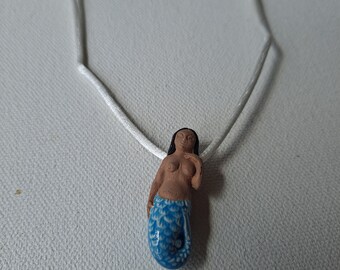 Black-haired dark skin Mermaid Clay Pendant on white cord