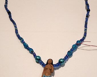 Black-haired dark skin Mermaid Clay Pendant on  bright  blue ball beaded necklace