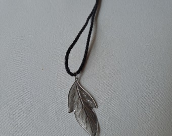 Pewter Hollow Long Cast Leaf Pendant on black braided leather necklace