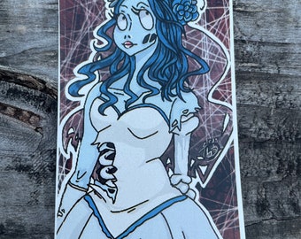 May include: A sticker featuring a cartoon illustration of a bride with blue hair, a white dress, and a flower crown. The background is a dark red with a spiderweb pattern.