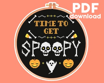 May include: Black and white cross-stitch pattern with the text "Time to Get Spoopy" and Halloween imagery including skulls, pumpkins, and a ghost.