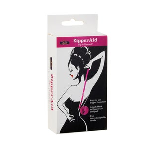 May include: A pink zipper aid tool with two interchangeable heads. The packaging features a black and white illustration of a woman using the tool to zip up a dress. The text on the packaging reads "ZipperAid Zip it Yourself".