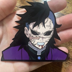 May include: A sticker of a character with black hair, a purple and black jacket, and a white shirt. The character has a pale face with red eyes and a bloody mouth.