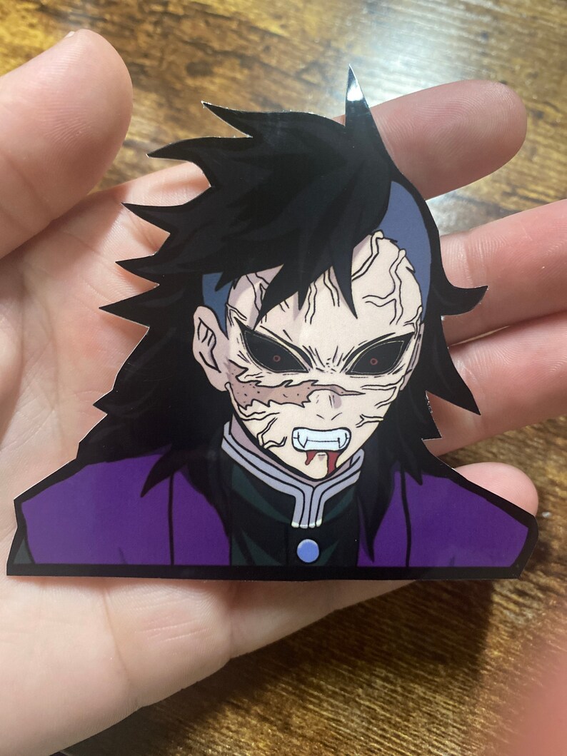 May include: A sticker of a character with black hair, a purple and black jacket, and a white shirt. The character has a pale face with red eyes and a bloody mouth.