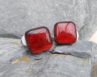 Hand made ruby red fused glass clip-on earrings made using dichroic glass