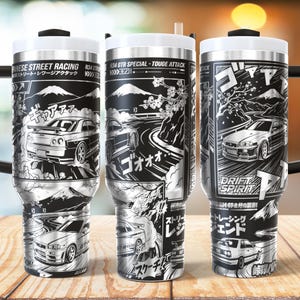May include: A stainless steel tumbler featuring a black and white manga-style graphic print of R34 GTR sports cars drifting on mountain roads, cherry blossoms, Mount Fuji, and Japanese text including "JAPANESE STREET RACING" and "DRIFT SPIRIT".