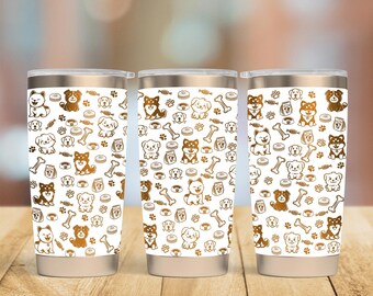 Könnte beinhalten: Drei Edelstahlbecher mit weißem Hintergrund und einem goldenen Muster aus Hunden, Knochen und Hundefutternapf.