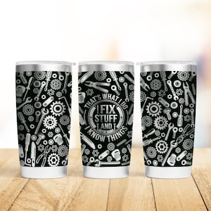 May include: Three stainless steel insulated tumblers with a black background and a pattern of tools. The center tumbler has the text "THAT'S WHAT I DO, I FIX STUFF AND I KNOW THINGS" in a circular design.