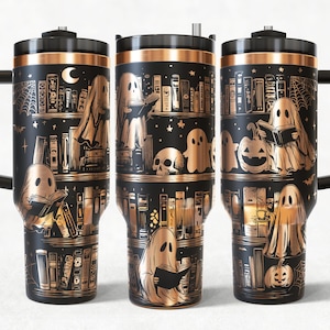 May include: Black travel mug with a copper-colored design featuring ghosts reading books in a library setting. The design includes a moon, bats, a spiderweb, a skull, and pumpkins. The mug has a black handle and lid.