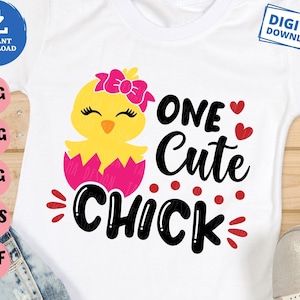 May include: White t-shirt featuring a yellow chick hatching from a pink egg, wearing a pink bow. The text "ONE Cute CHICK" is in black, with red hearts and accents. Includes "Instant Download" and "Digital Download" icons.
