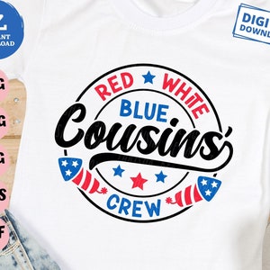 May include: White t-shirt with a circular graphic that reads "RED WHITE BLUE Cousins CREW" in red, white, and blue. The design includes stars and firework illustrations, perfect for a family gathering.