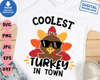 May include: White t-shirt featuring a cartoon turkey wearing sunglasses, with the text "COOLEST TURKEY IN TOWN" in black. The turkey has brown feathers and a red wattle, with orange and red tail feathers. The shirt also has "Instant Download" and "Digital Download" text.