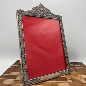Antique Silver Repoussé Picture Frame – Asian Deity Crest, Early 20th Century, Handcrafted