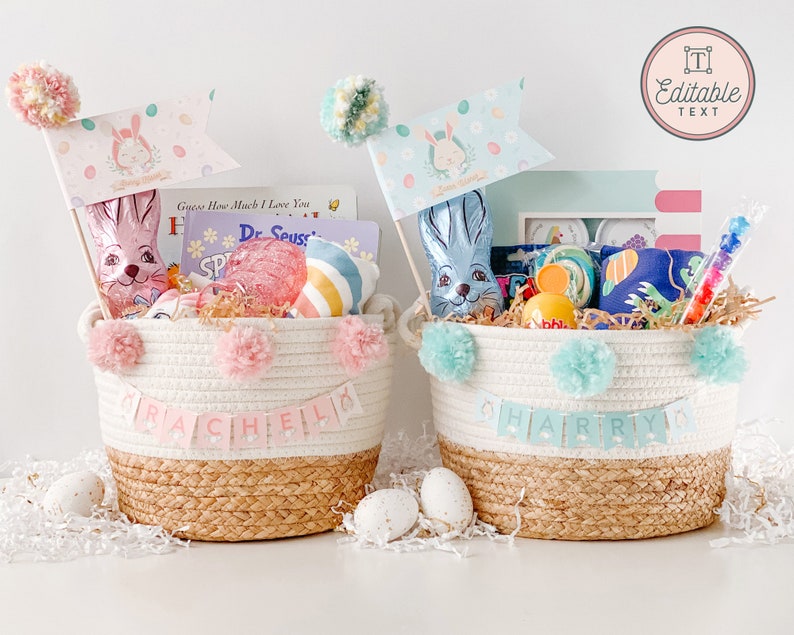 May include: Two Easter baskets filled with gifts for children. The baskets are made of rope and have a white and brown color scheme. The baskets are decorated with pom-poms and banners. The baskets are filled with toys, candy, and books. The baskets are labeled "RACHEL" and "HARRY".
