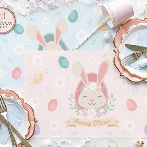 May include: Pink and blue Easter bunny themed placemats with a floral design and the text "Bunny Kisses".