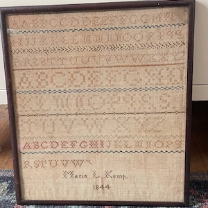 May include: A set of three ceramic mugs with a speckled, matte finish. The mugs are in shades of cream, light gray, and dark gray. Each mug has a simple, minimalist design and a rounded handle.