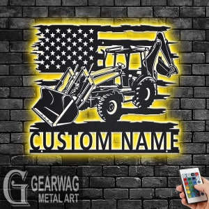 May include: Black metal silhouette of a backhoe excavator with a US flag design behind it. The backhoe is on a yellow background with the words "CUSTOM NAME" below it.