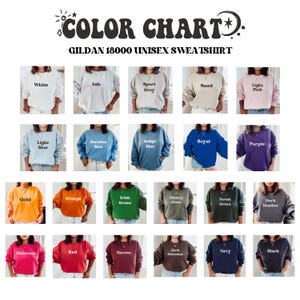 May include: Colour chart displaying 24 different colours of Gildan 18000 unisex sweatshirts. The colours include white, ash, sport grey, sand, light pink, light blue, carolina blue, indigo blue, royal blue, purple, gold, orange, irish green, military green, forest green, dark heather, heliconia, red, maroon, dark chocolate, navy, and black.