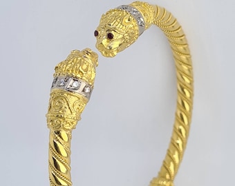 18K Gold Lion Head Bracelet with Diamonds and Ruby eyes.