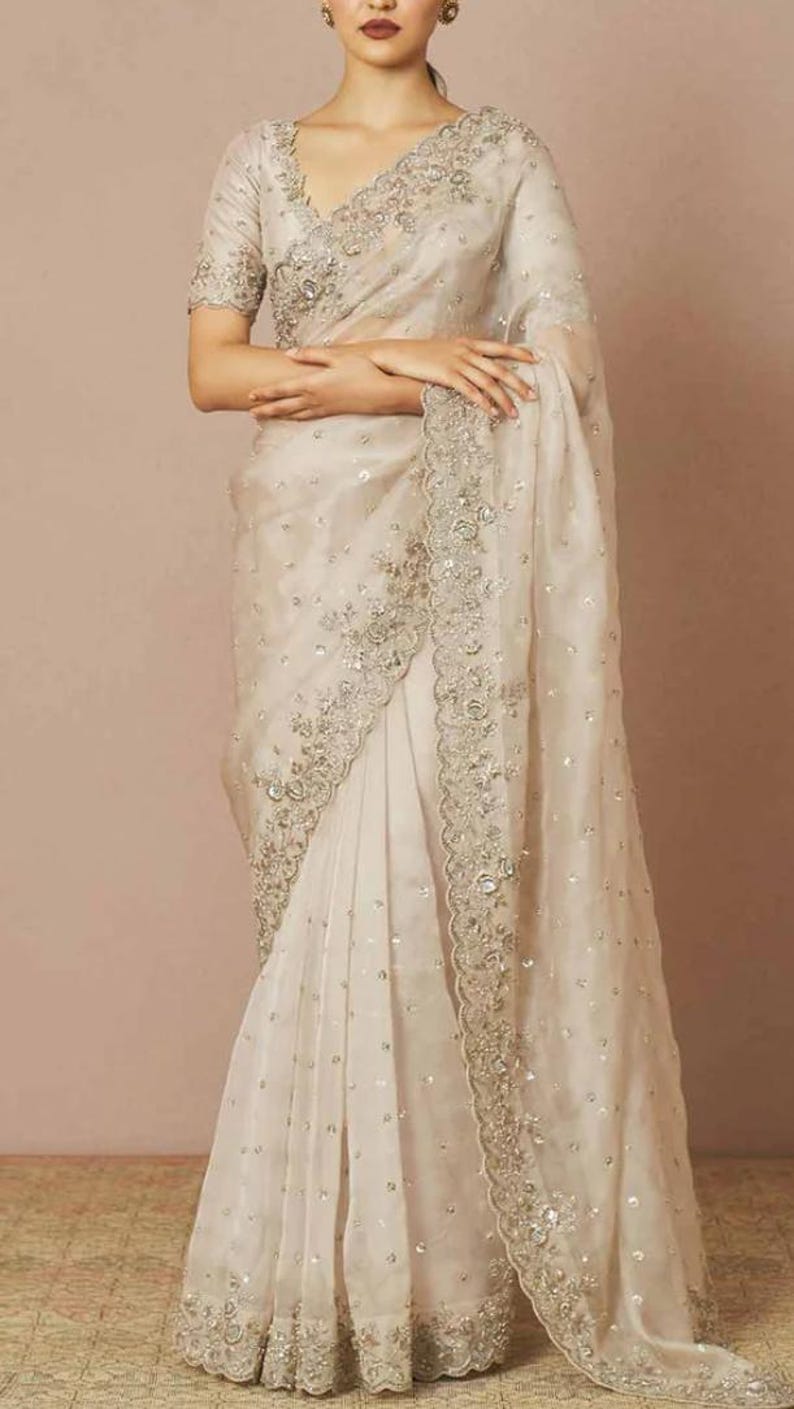 Elixir White and Gold Organza embroidered Saree with blouse fabric