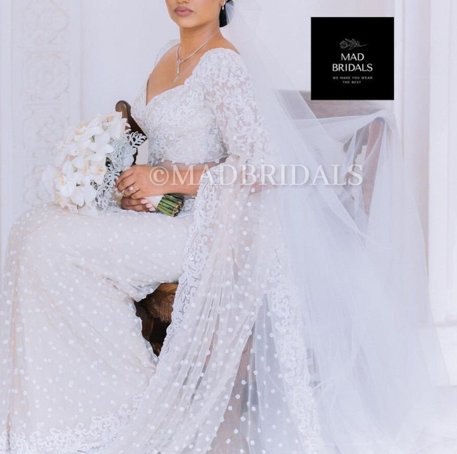 Off White Mirror and Pearl Drop Bridal lehenga set with Veil