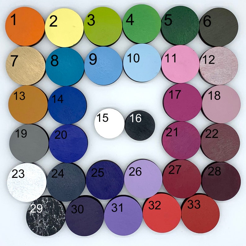 May include: A set of 33 round wooden discs, each painted a different color. The discs are arranged in a grid pattern, with the numbers 1 through 33 printed on each disc.
