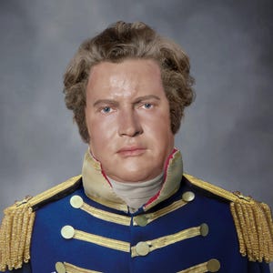 May include: A portrait of a man in a blue military jacket with gold accents, epaulettes, and buttons. The jacket has gold stripes and a high collar. The man has fair skin, blue eyes, and light brown hair. A signature is visible at the bottom.